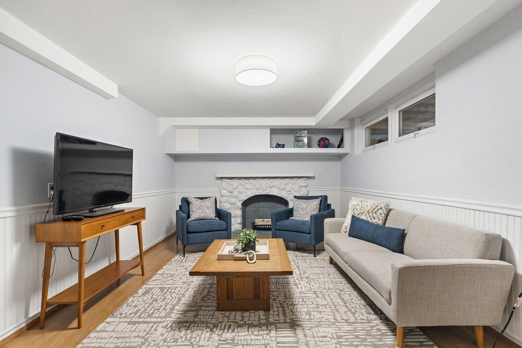 26 Leland Road Brookline, MA 02467 - Photo 21 of 30 a living room with furniture and a fireplace