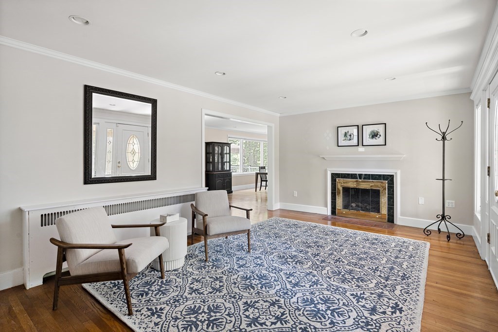 26 Leland Road Brookline, MA 02467 - Photo 4 of 30 a living room with furniture a fireplace and wooden floor