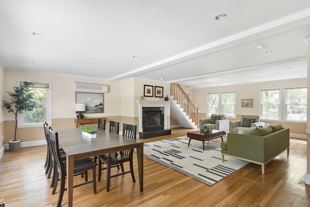 26 Leland Road Brookline, MA 02467 - Photo 7 of 30 a living room with furniture a dining table and a fireplace