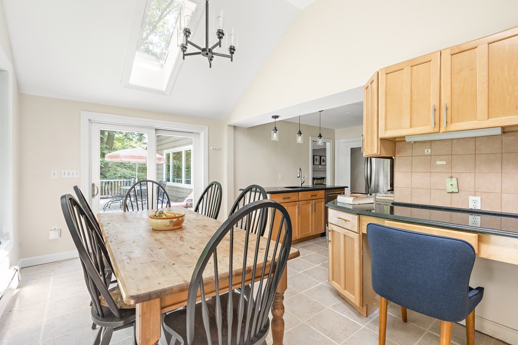 26 Leland Road Brookline, MA 02467 - Photo 9 of 30 a view of a dining room with furniture window and outside view
