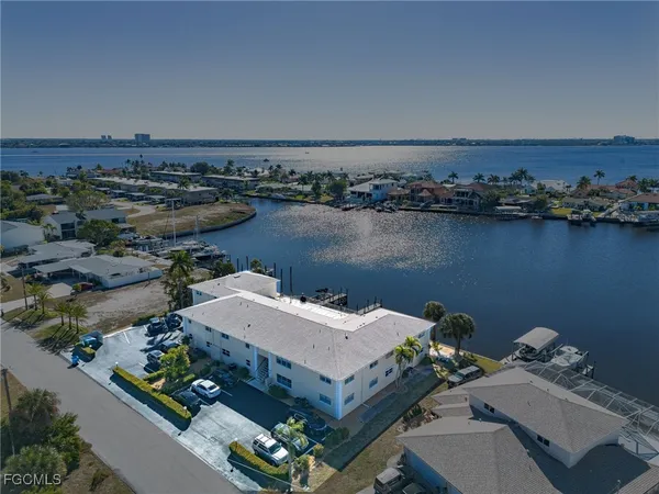 an aerial view of a house with a lake view