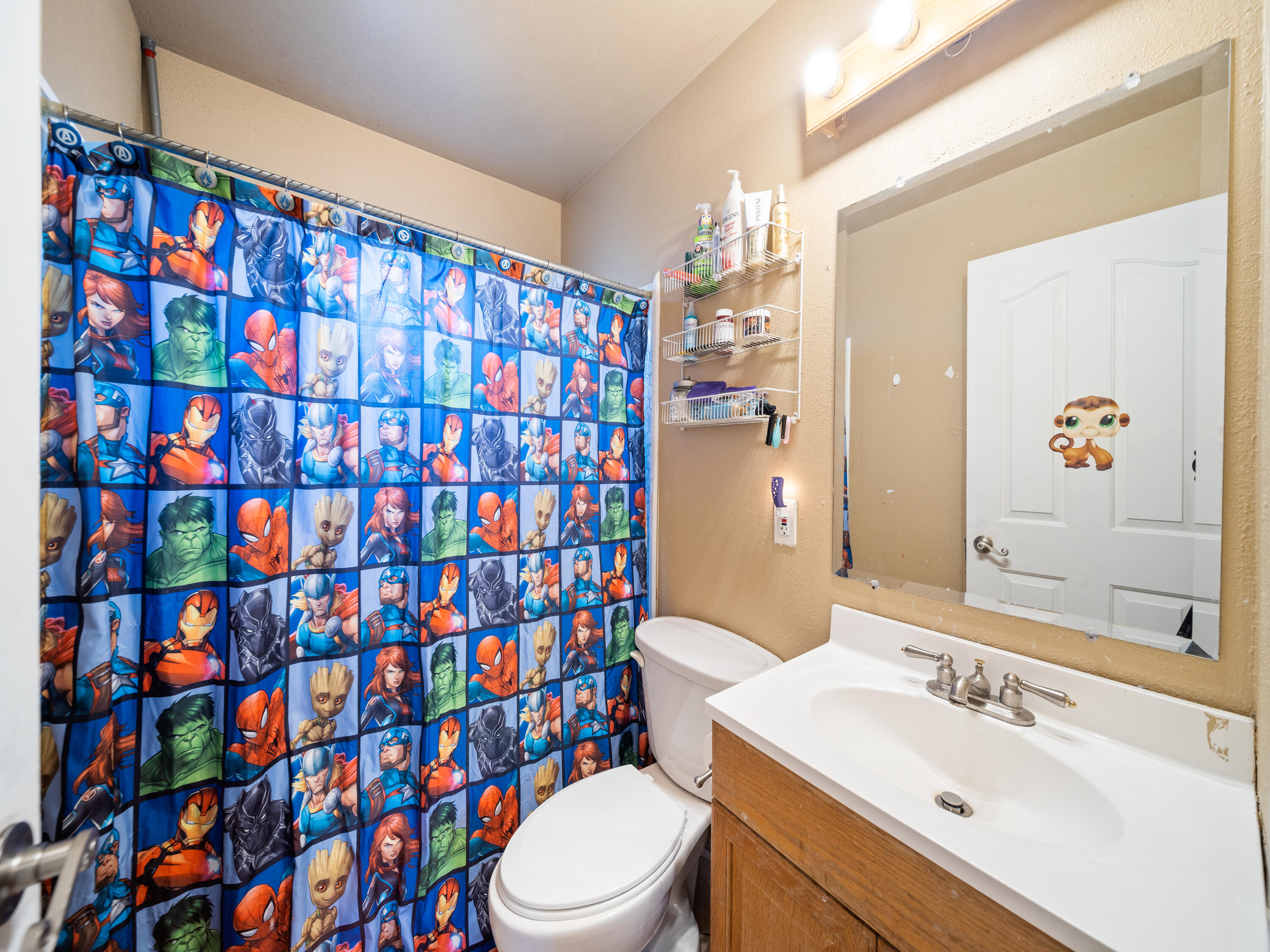 2921 West Way Redding, CA 96002 - Photo 11 of 36 a bathroom with a sink toilet and shower