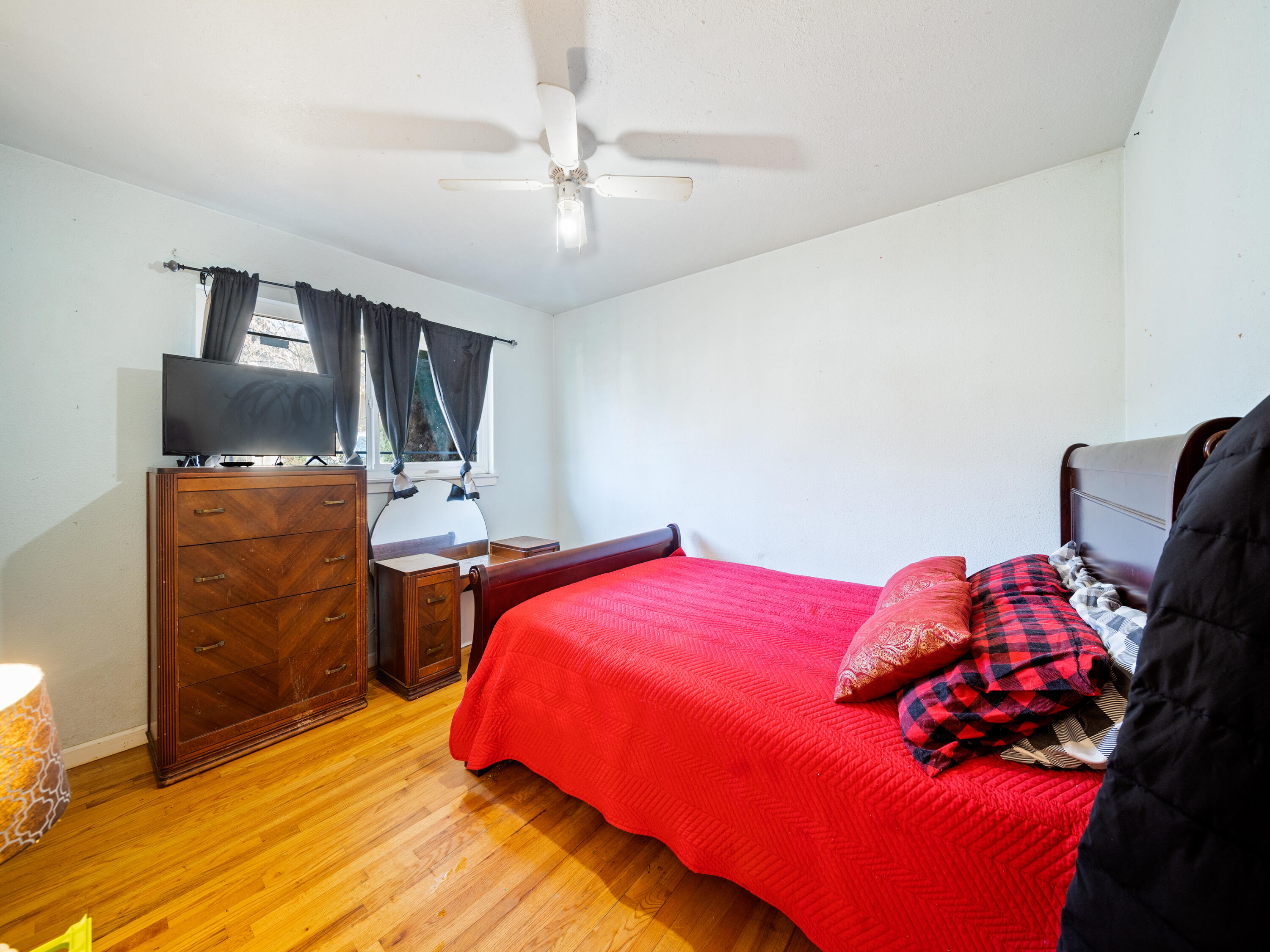 2921 West Way Redding, CA 96002 - Photo 12 of 36 a bedroom with a bed and a flat screen tv