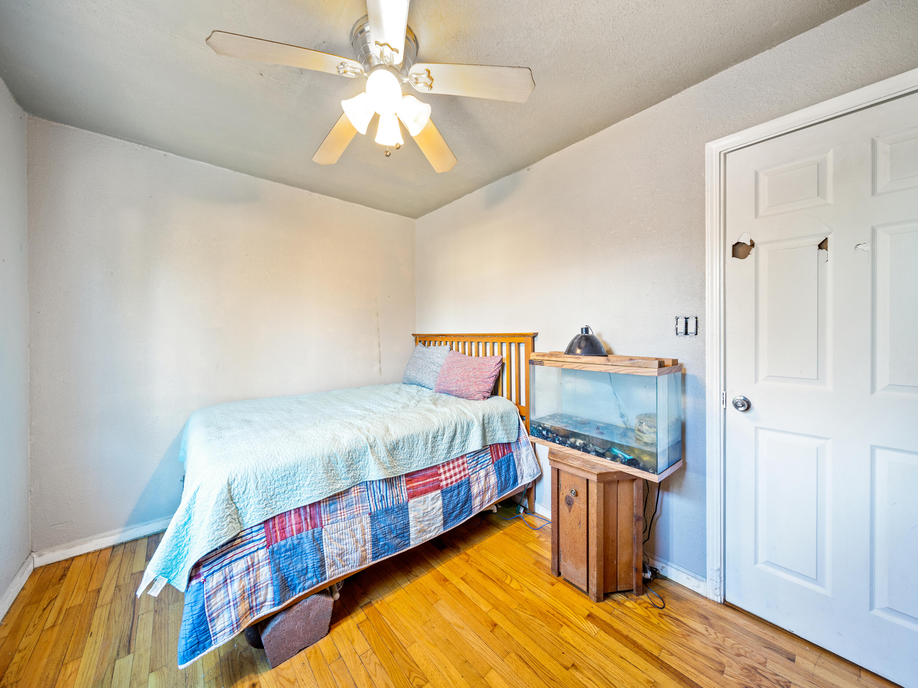 2921 West Way Redding, CA 96002 - Photo 18 of 36 a bedroom with bed and wooden floor