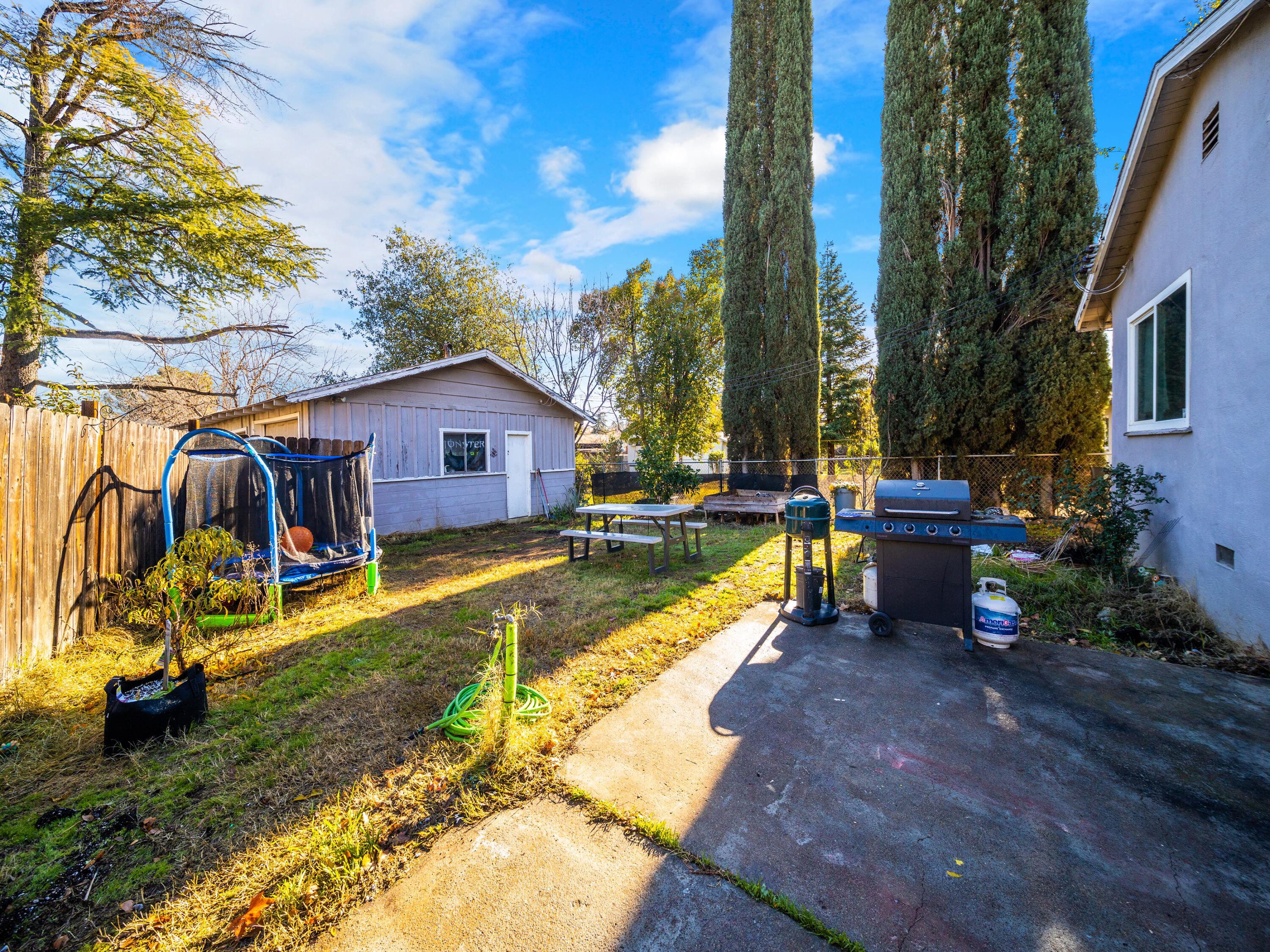 2921 West Way Redding, CA 96002 - Photo 22 of 36 a view of a house with swimming pool and sitting area