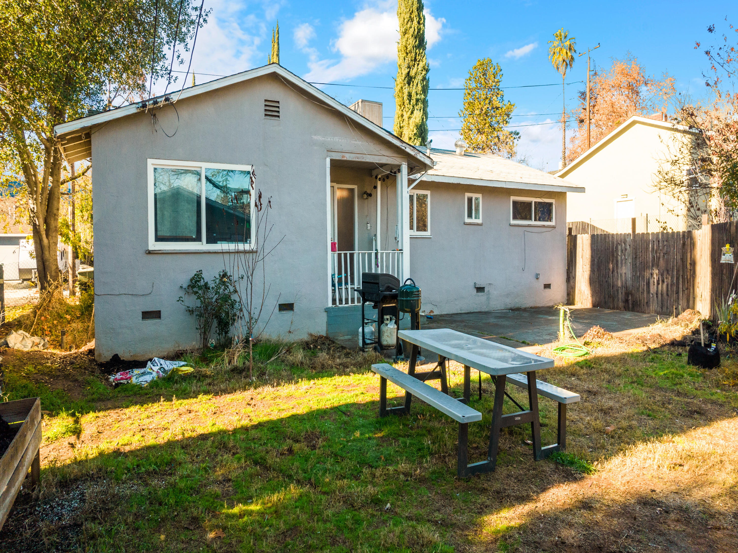 2921 West Way Redding, CA 96002 - Photo 23 of 36 a view of a house with backyard and sitting area