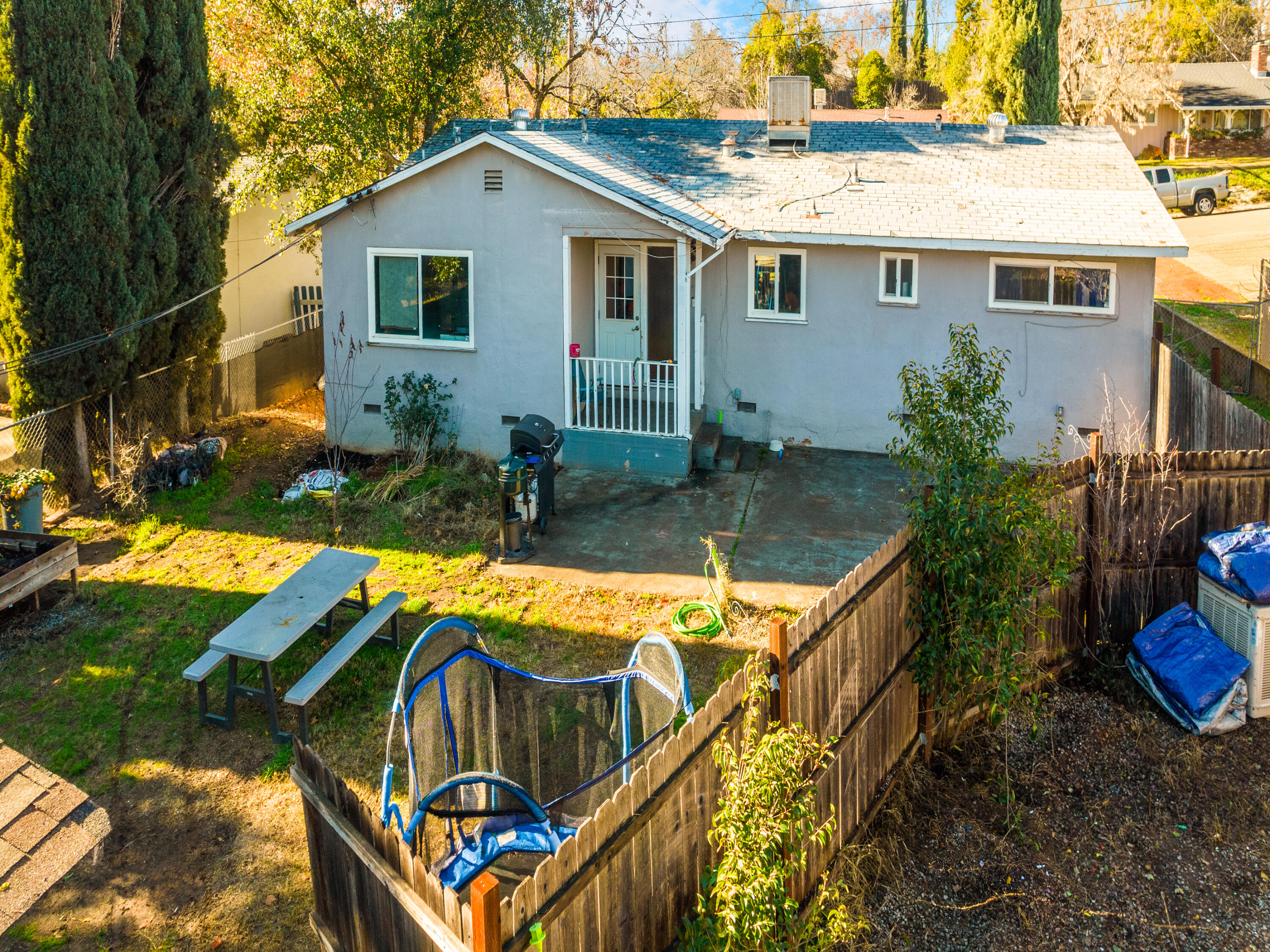 2921 West Way Redding, CA 96002 - Photo 24 of 36 a view of backyard with outdoor seating and barbeque oven