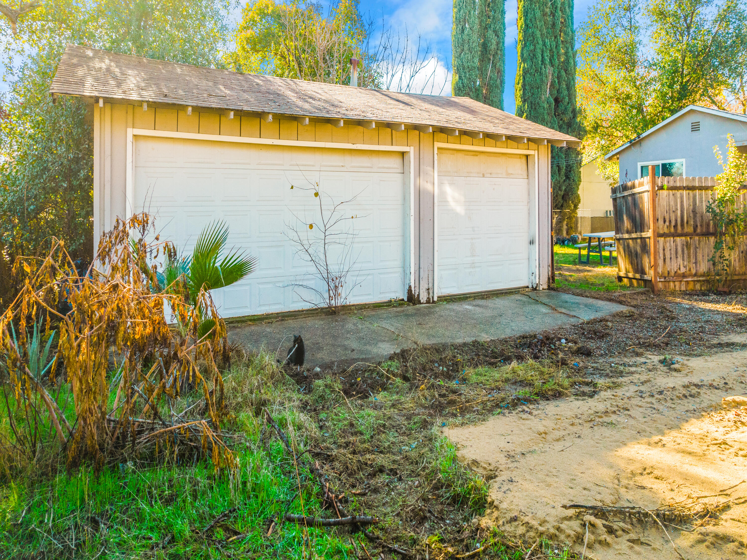 2921 West Way Redding, CA 96002 - Photo 29 of 36 a view of a blue garage with a small yard