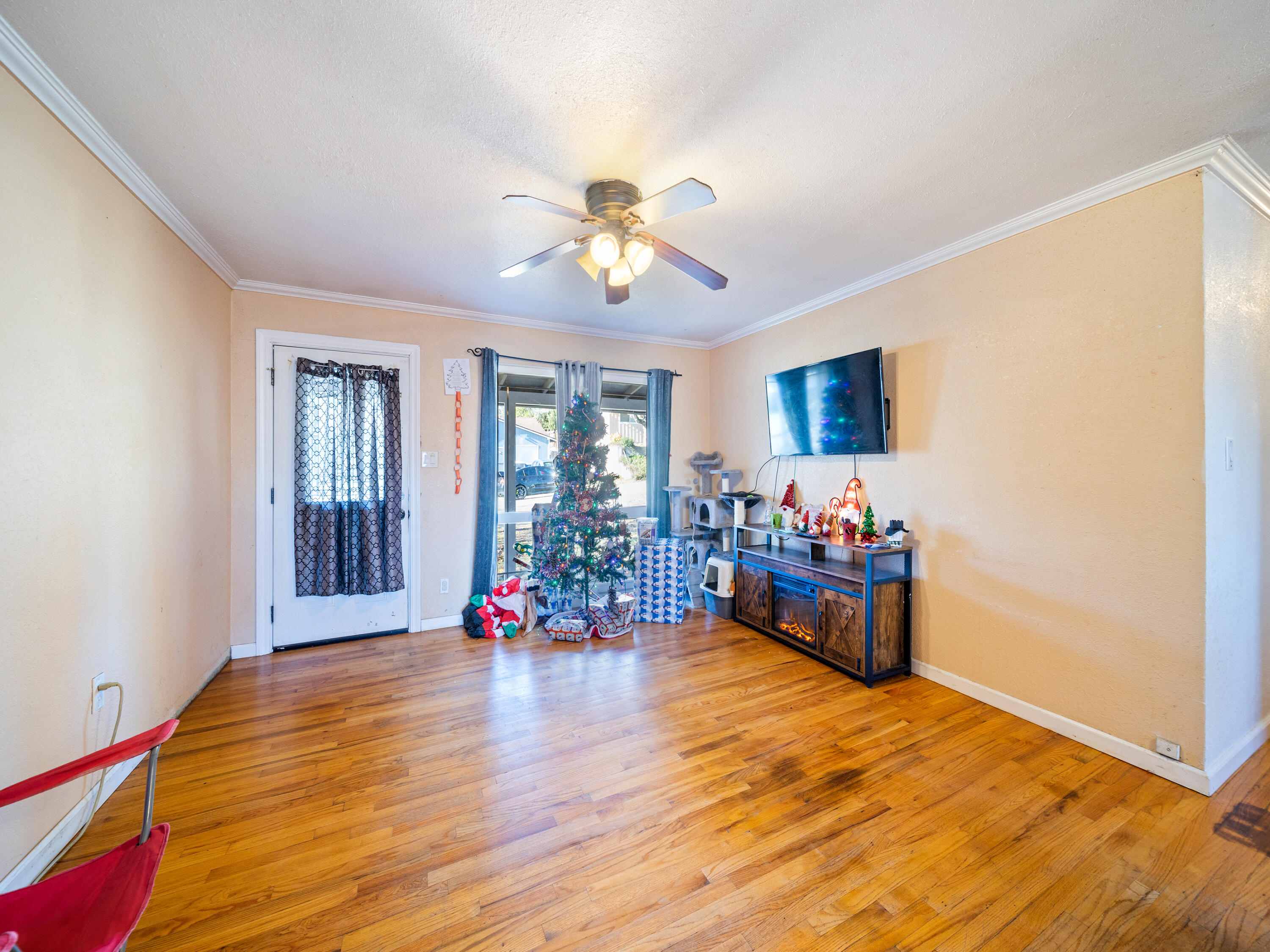 2921 West Way Redding, CA 96002 - Photo 3 of 36 a living room with furniture and a flat screen tv