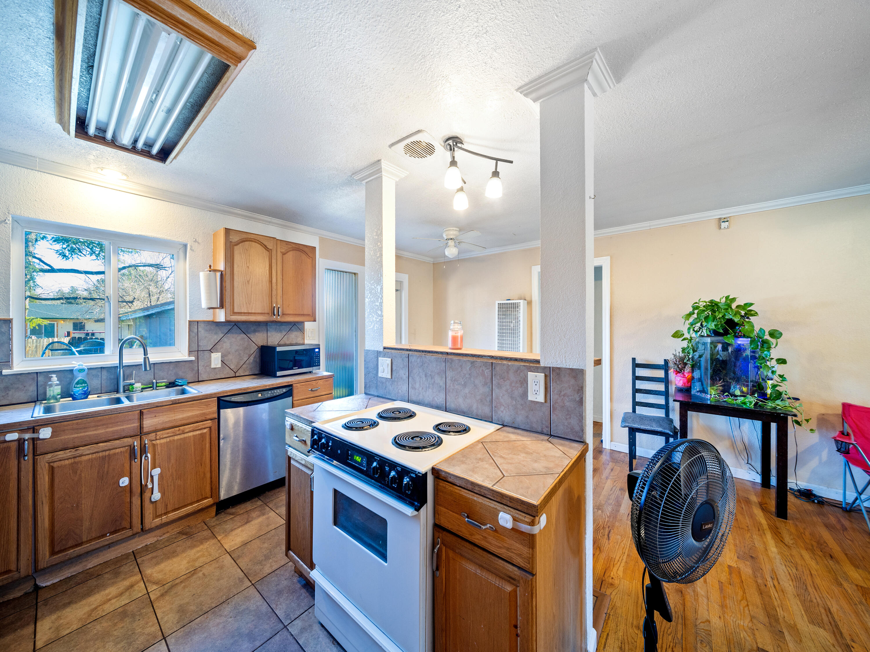 2921 West Way Redding, CA 96002 - Photo 7 of 36 a kitchen that has a sink and a stove