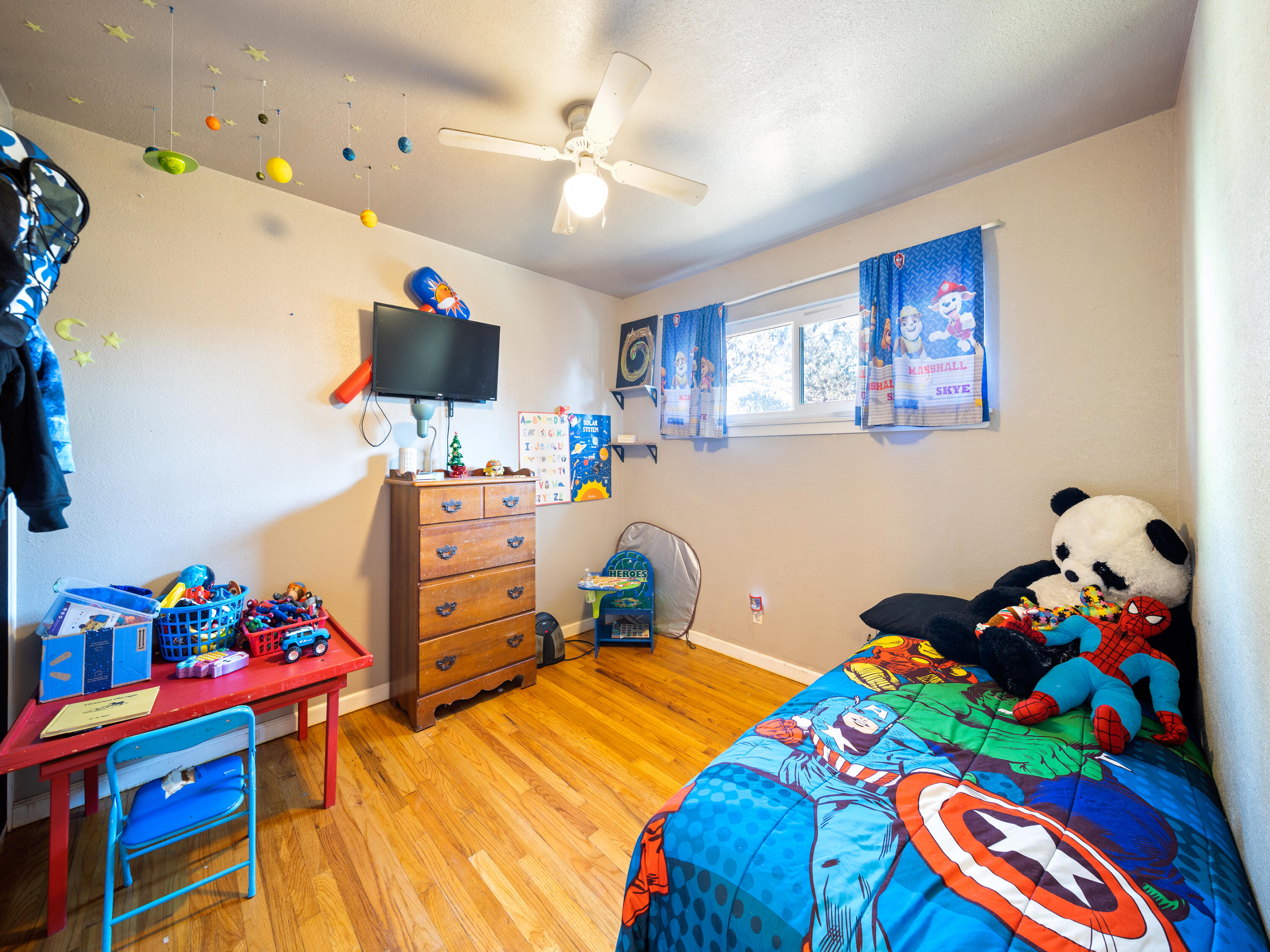 2921 West Way Redding, CA 96002 - Photo 10 of 36 a bedroom with a bed furniture and a flat screen tv