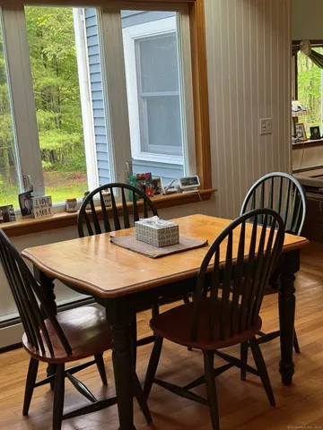 a dining room with furniture and window