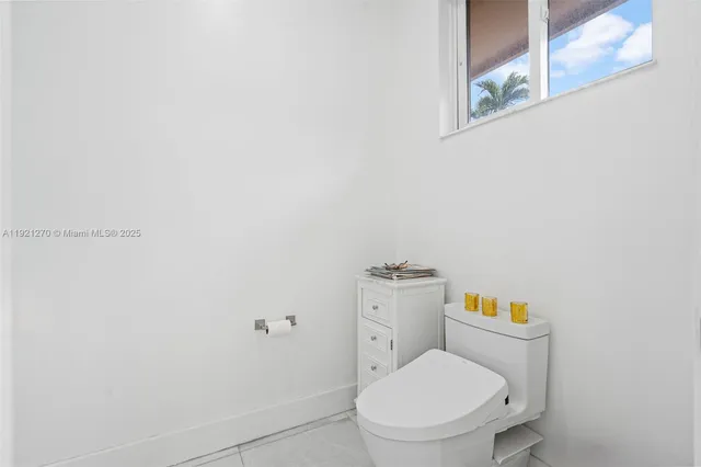 a view of a porch with wooden floor and iron stairs
