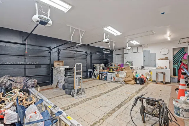 a view of a house with swimming pool and sitting area