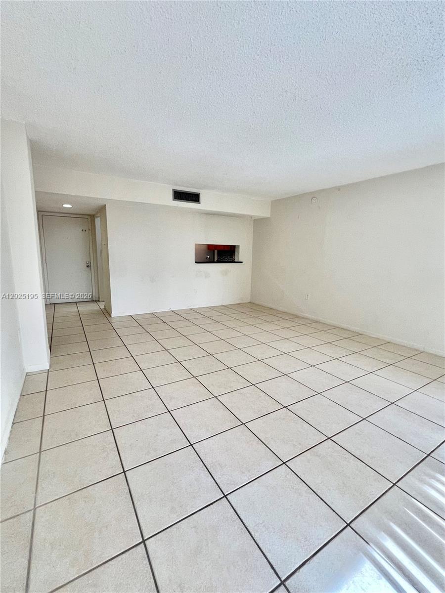8400 Southwest 133rd Avenue Road, Unit 121 Miami, FL 33183 - Photo 39 of 43 a view of an empty room and window