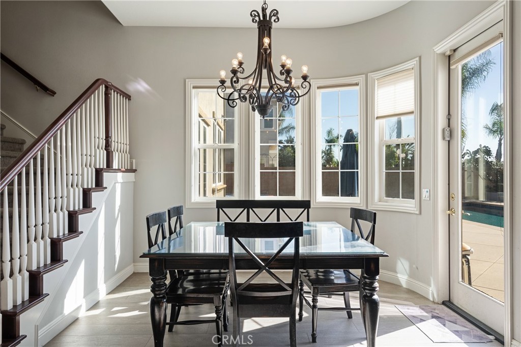 9669 Norbrook Drive Rancho Cucamonga, CA 91737 - Photo 15 of 47 a view of a dining room with furniture window and wooden floor