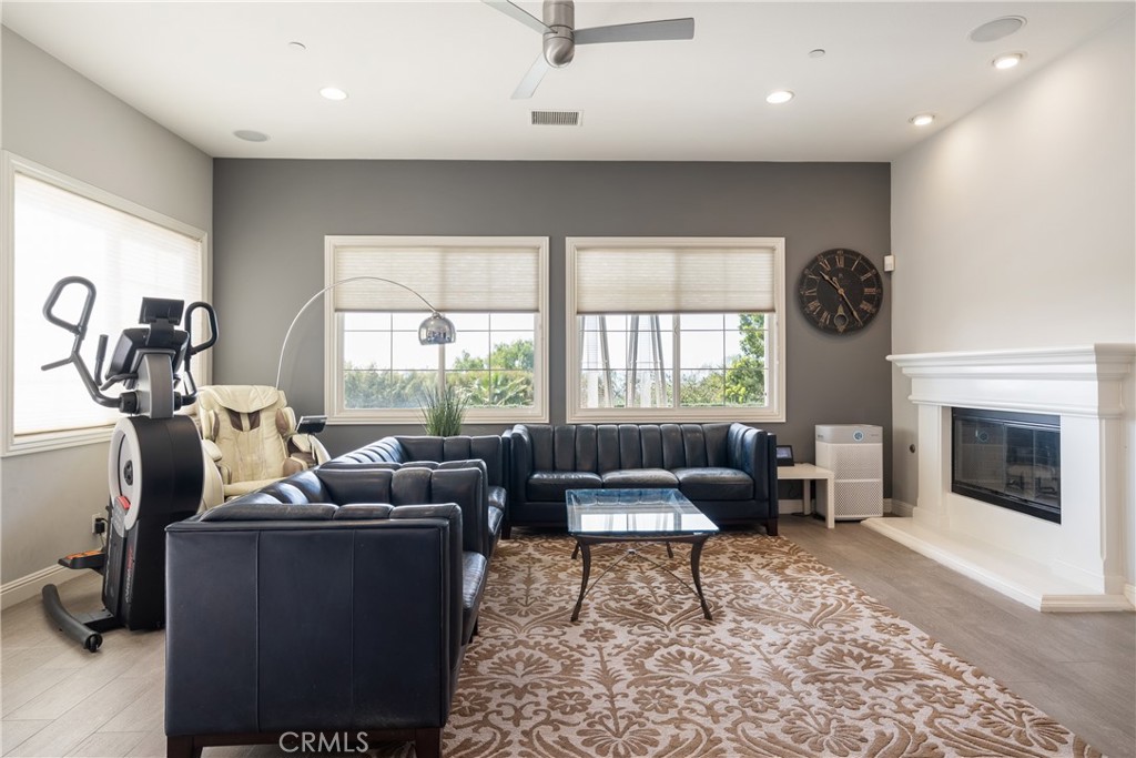 9669 Norbrook Drive Rancho Cucamonga, CA 91737 - Photo 16 of 47 a living room with furniture window and fireplace