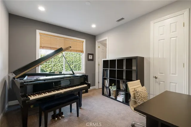 a view of workspace with furniture and window