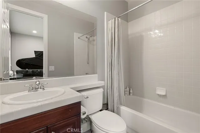 a bathroom with a sink toilet a tub and shower