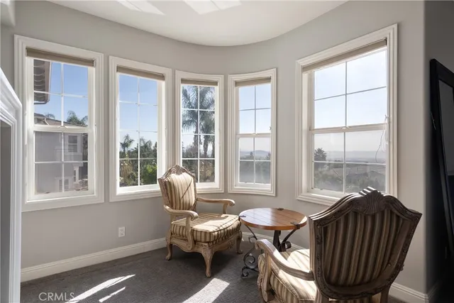 a living room with furniture and windows