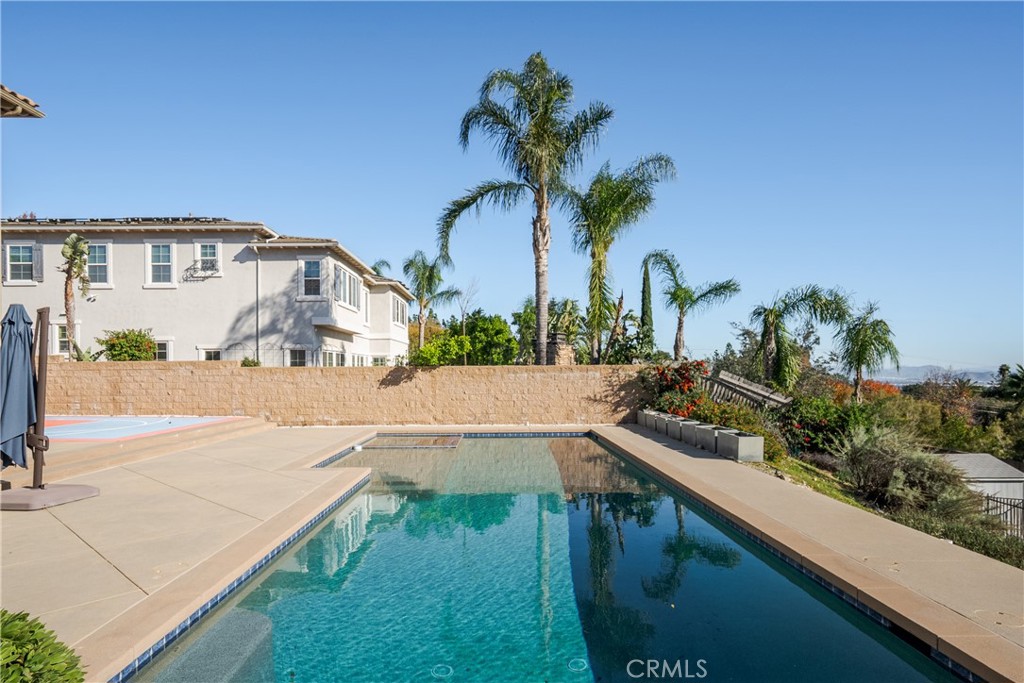 9669 Norbrook Drive Rancho Cucamonga, CA 91737 - Photo 35 of 47 a view of a yard and front view of a house