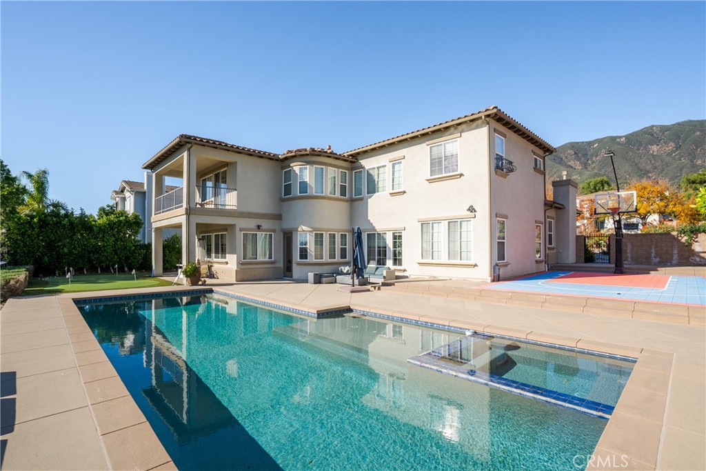 9669 Norbrook Drive Rancho Cucamonga, CA 91737 - Photo 37 of 47 a view of a house with sitting area and swimming pool