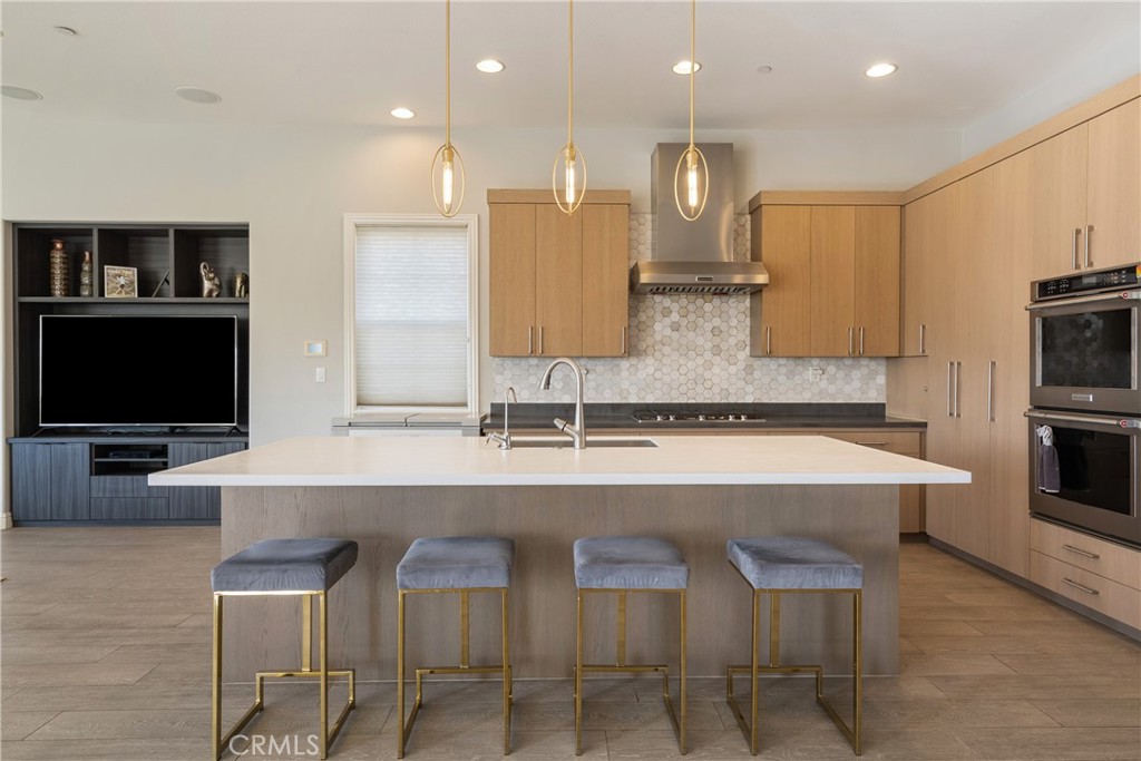 9669 Norbrook Drive Rancho Cucamonga, CA 91737 - Photo 9 of 47 a large kitchen with a table and chairs in it