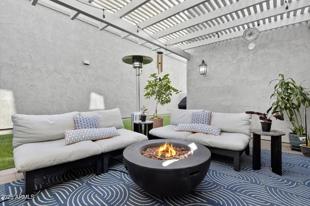 a living room with furniture and a rug