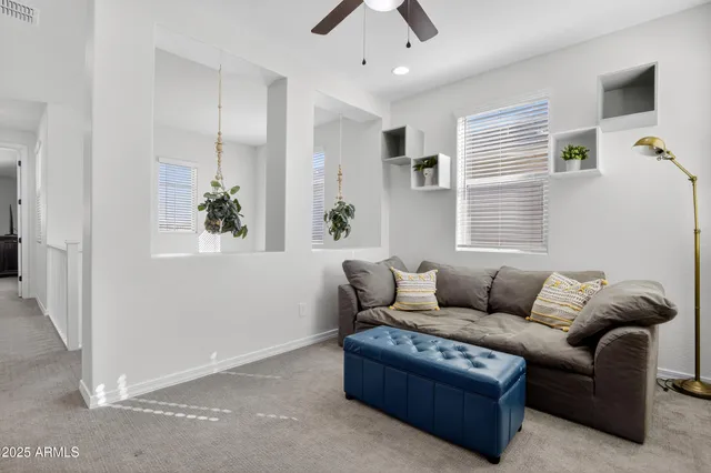 a living room with furniture and a window