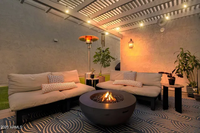 a living room with furniture and a rug