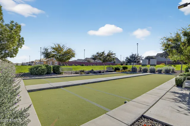 a view of a swimming pool and outdoor seating