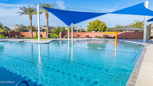swimming pool view with seating space