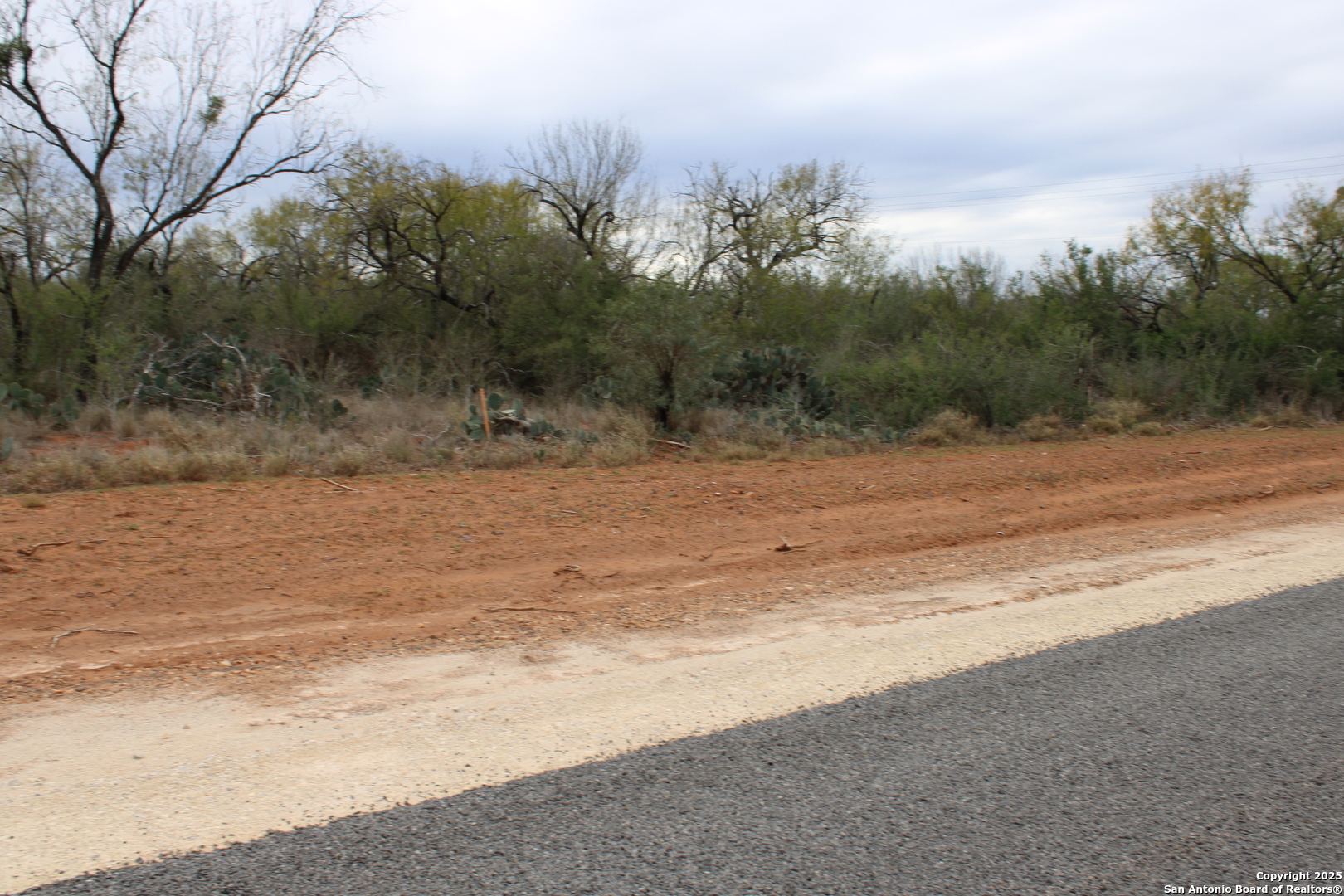 3435 County Road/main Street Pearsall, TX 78061 - Photo 4 of 7 a view of a beach with a yard
