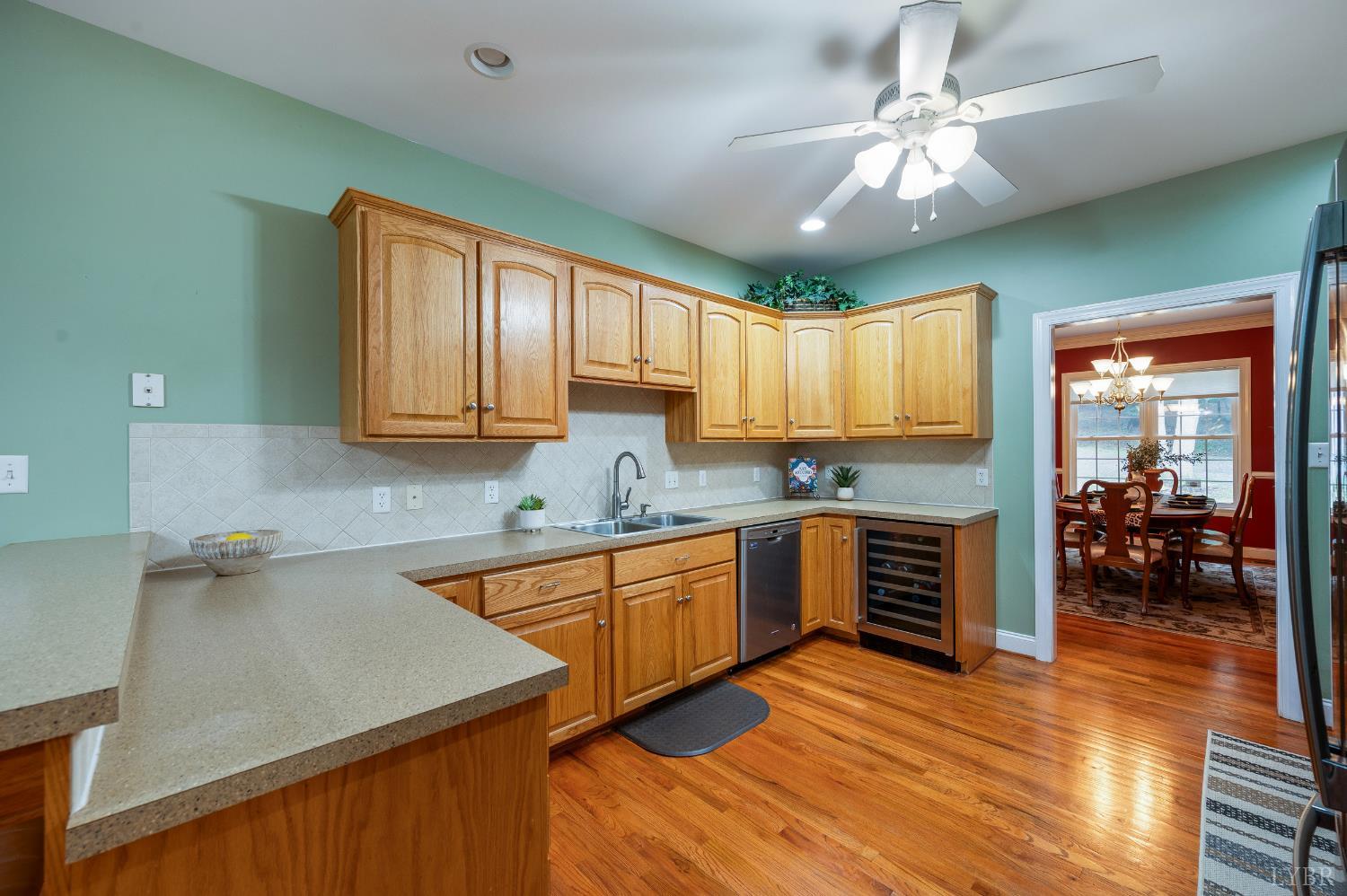 429 Matohe Road Monroe, VA 24574 - Photo 18 of 73 a kitchen with stainless steel appliances granite countertop a sink dishwasher stove and refrigerator with wooden floor