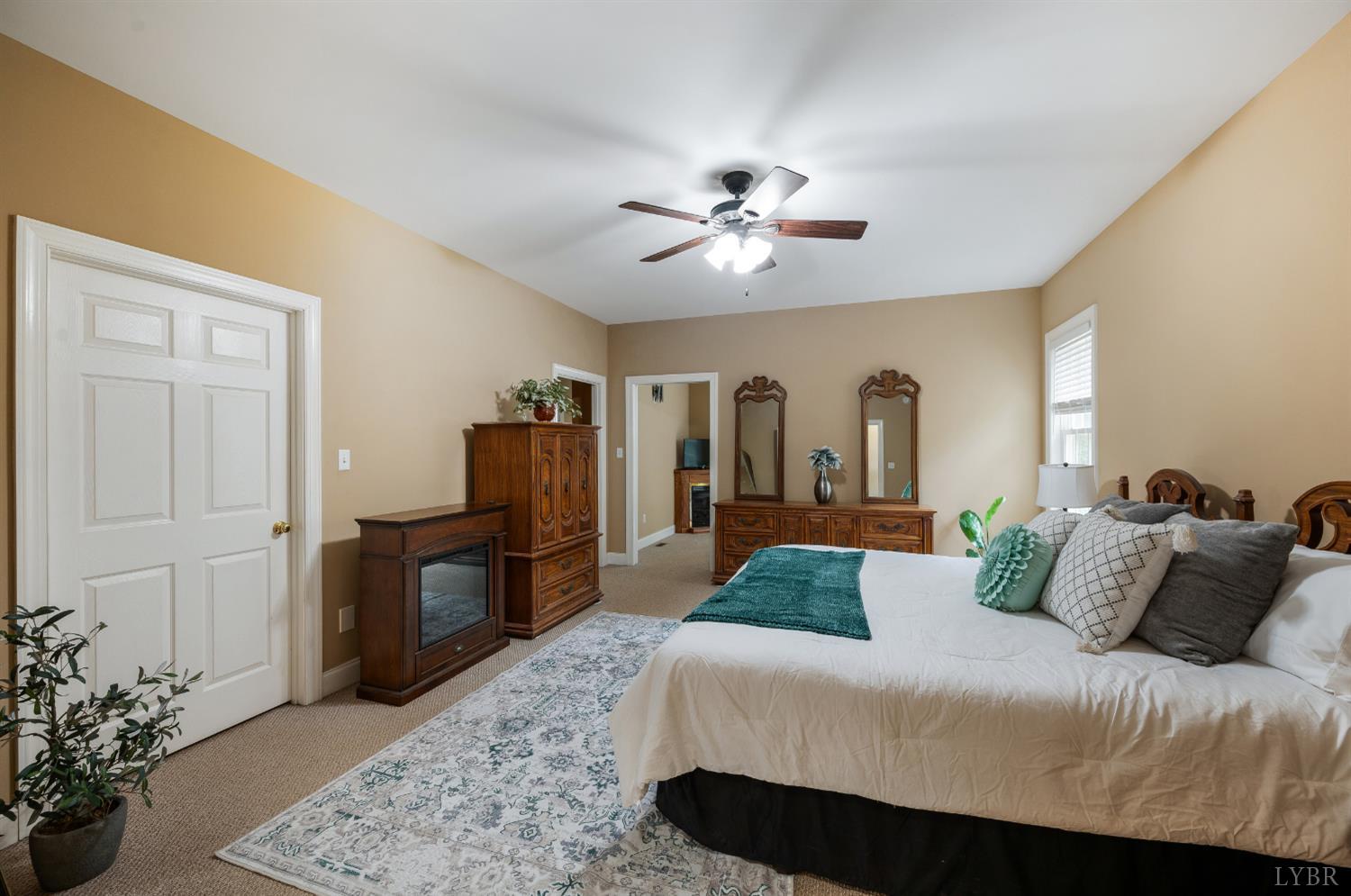 429 Matohe Road Monroe, VA 24574 - Photo 25 of 73 a bedroom with a large bed and a chandelier