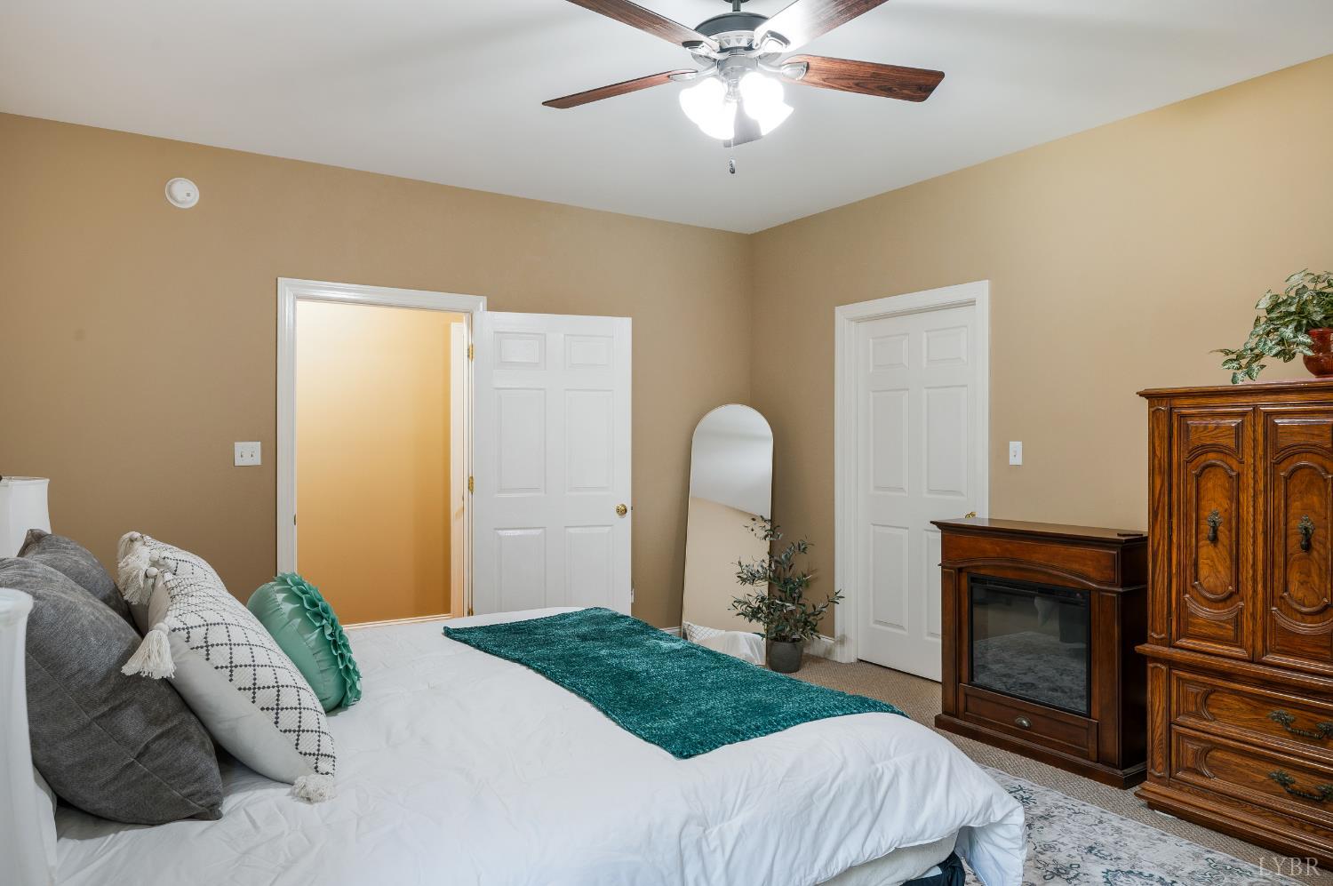 429 Matohe Road Monroe, VA 24574 - Photo 28 of 73 a bedroom with a bed and a fireplace