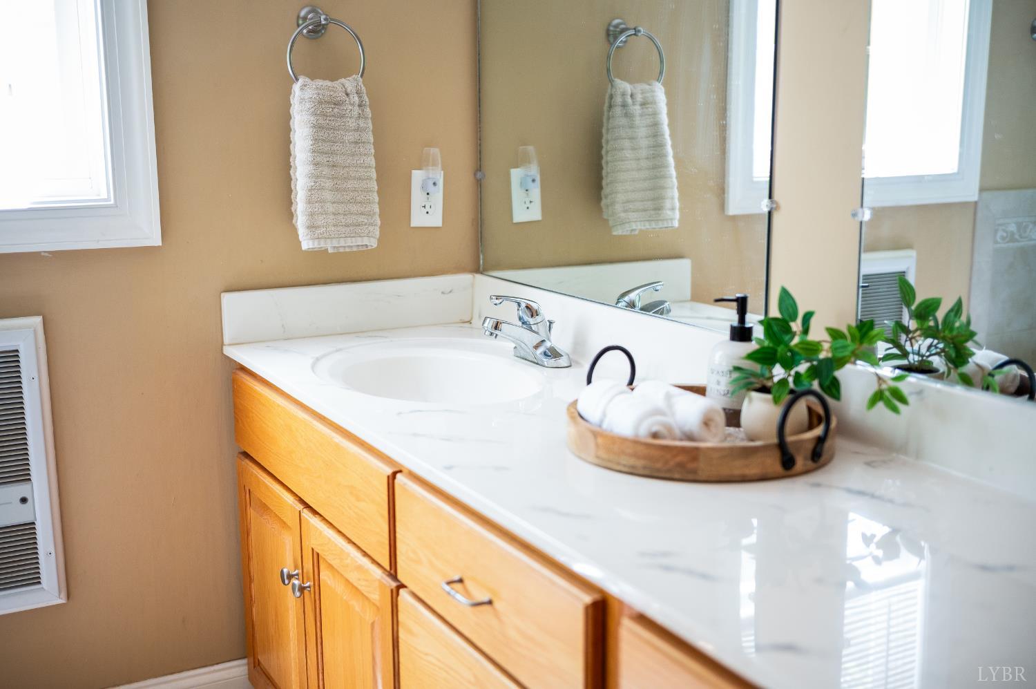 429 Matohe Road Monroe, VA 24574 - Photo 32 of 73 a bathroom with a sink a vanity and a mirror