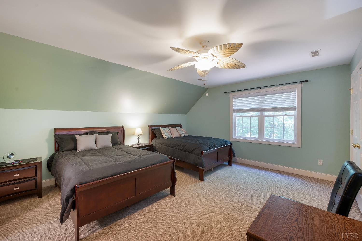429 Matohe Road Monroe, VA 24574 - Photo 40 of 73 a bedroom with a bed and a chandelier