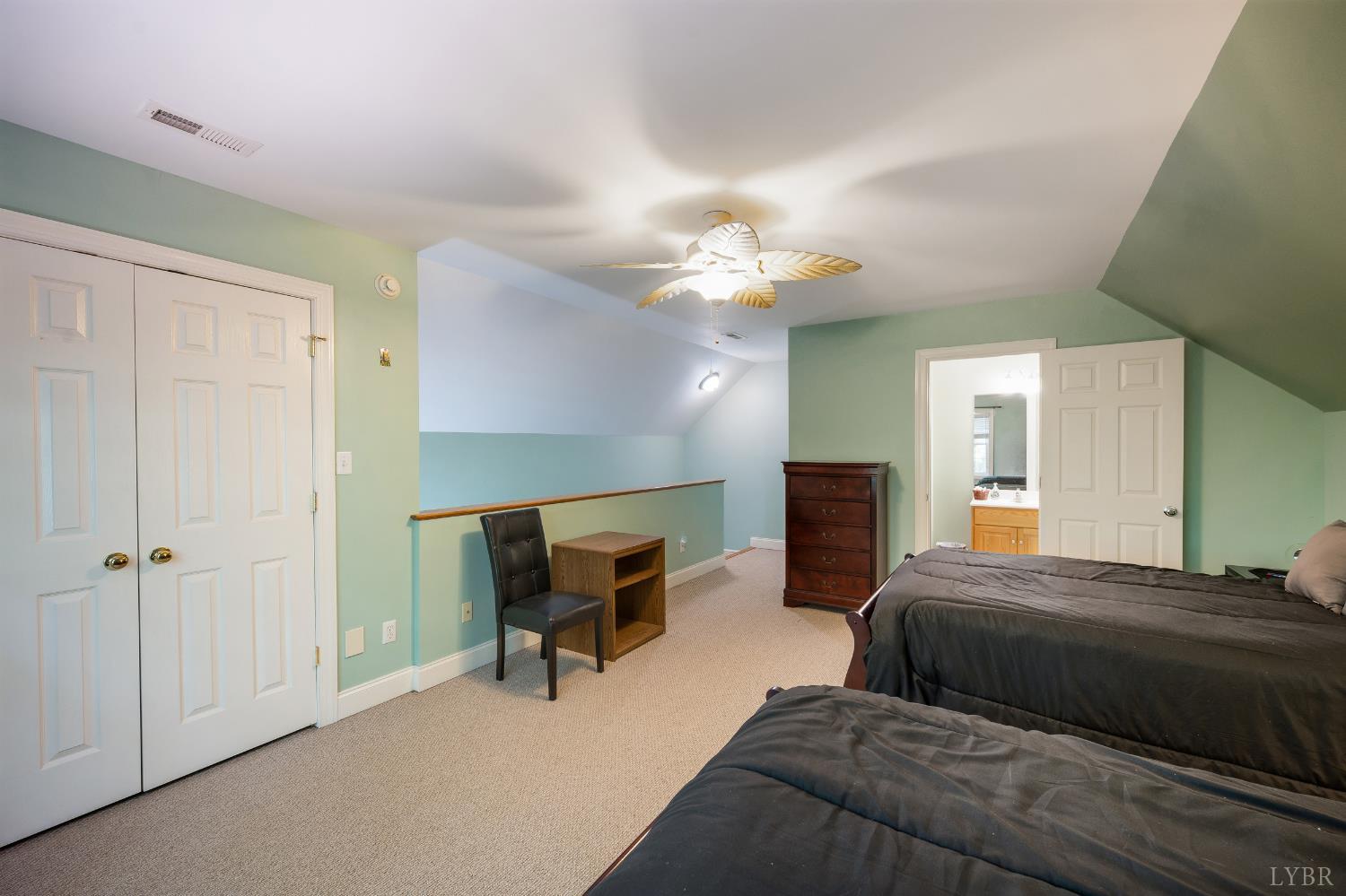 429 Matohe Road Monroe, VA 24574 - Photo 41 of 73 a bedroom with a bed and a chandelier
