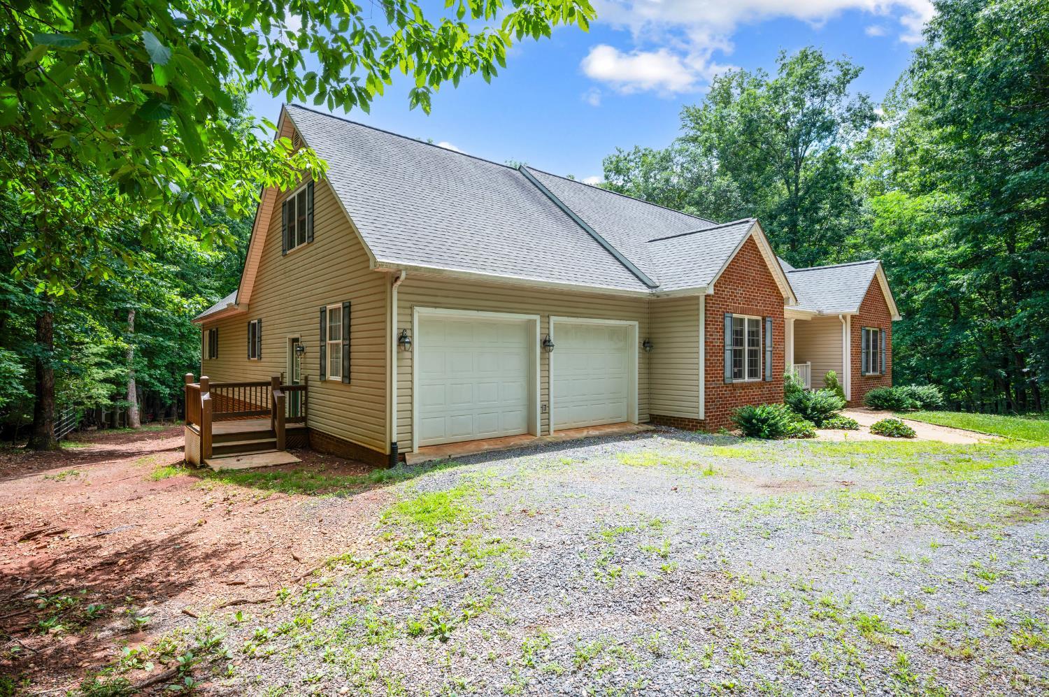429 Matohe Road Monroe, VA 24574 - Photo 44 of 73 a front view of a house with a garden and trees