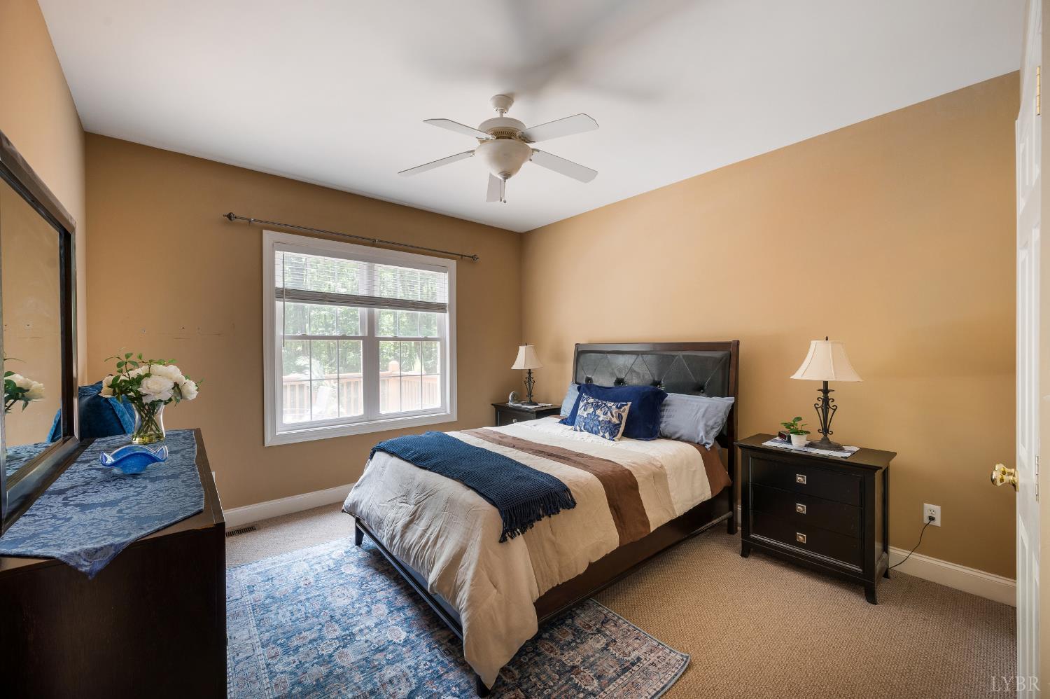 429 Matohe Road Monroe, VA 24574 - Photo 48 of 73 a bedroom with a bed and a chandelier