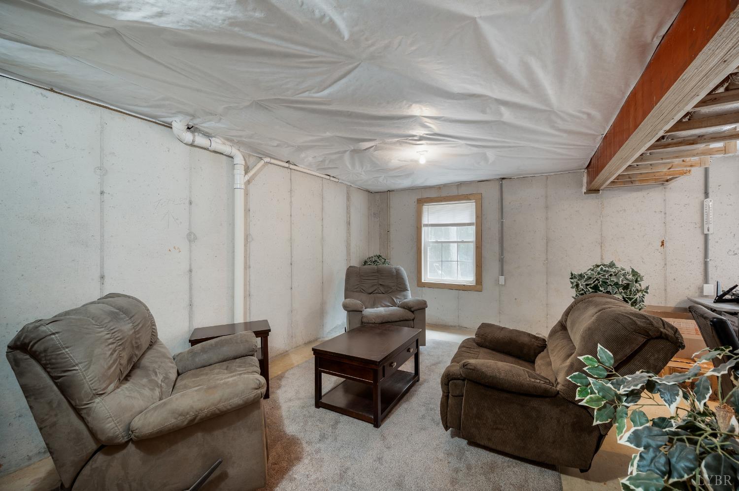 429 Matohe Road Monroe, VA 24574 - Photo 64 of 73 a living room with furniture and a potted plant