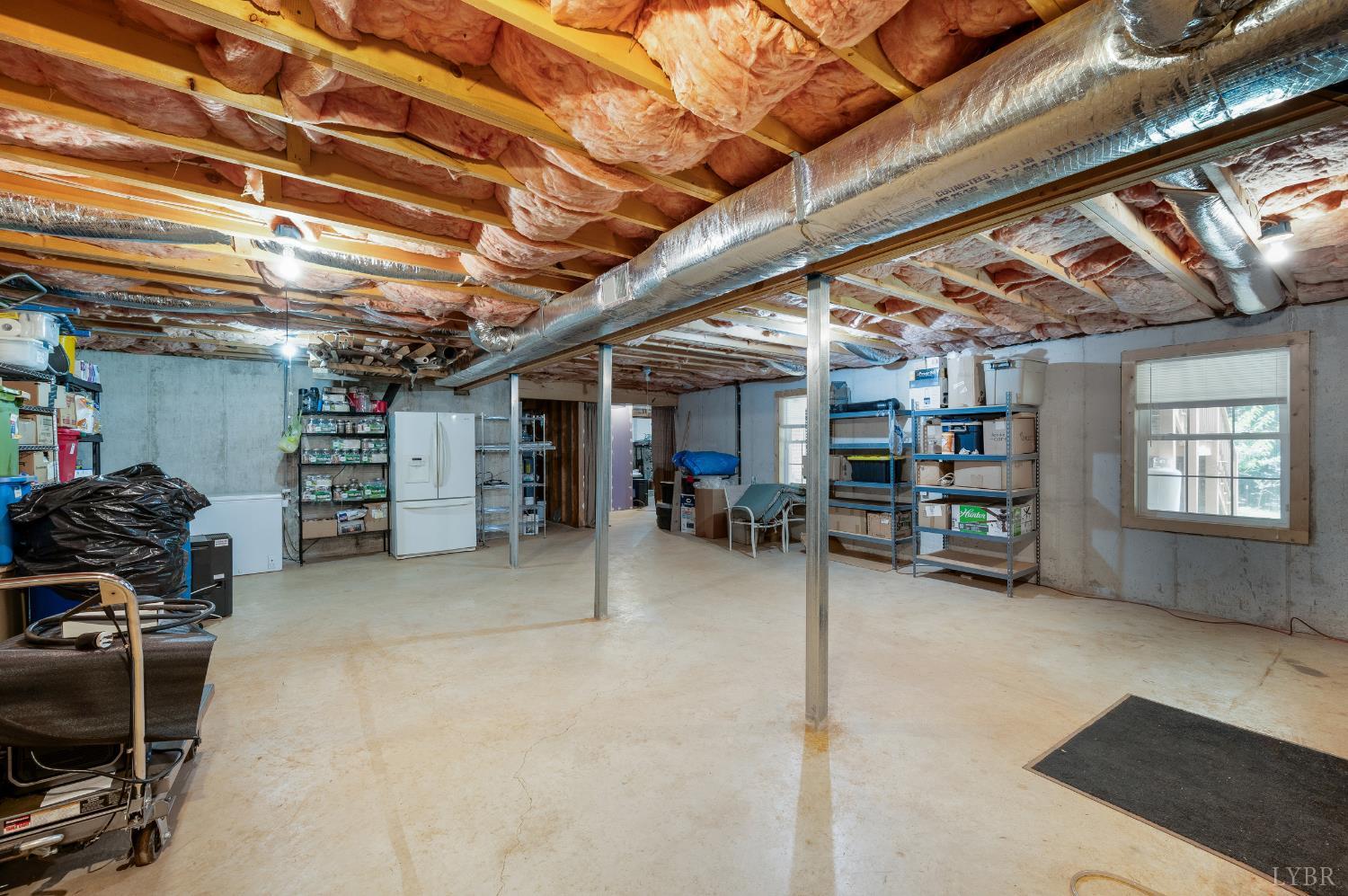 429 Matohe Road Monroe, VA 24574 - Photo 65 of 73 a view of a storage room with furniture and a ceiling fan