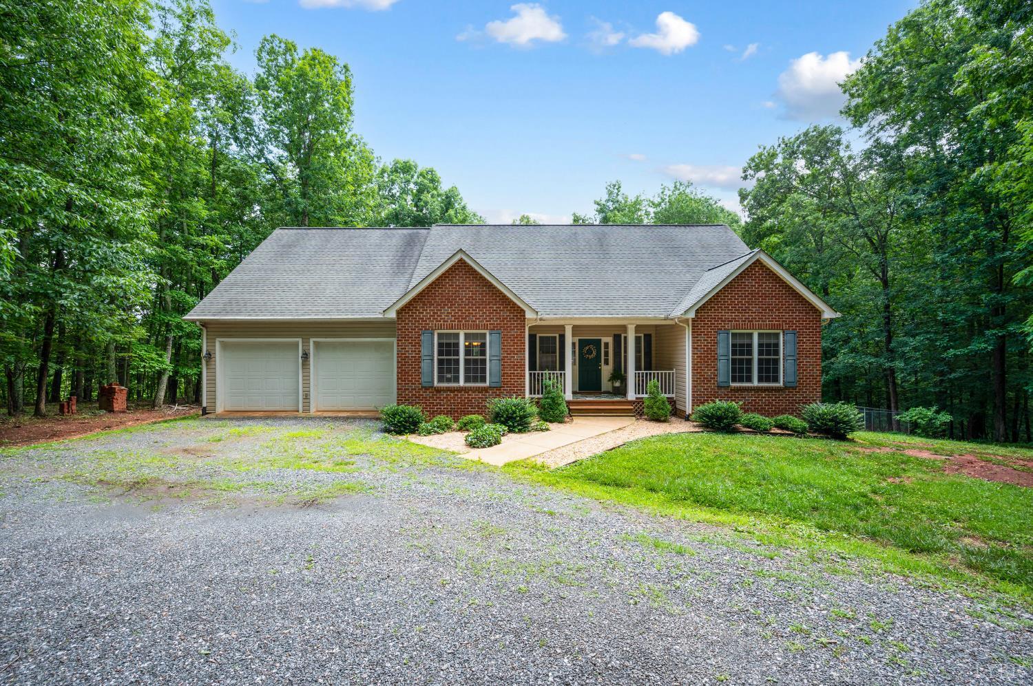 429 Matohe Road Monroe, VA 24574 - Photo 67 of 73 a front view of a house with a yard and garage
