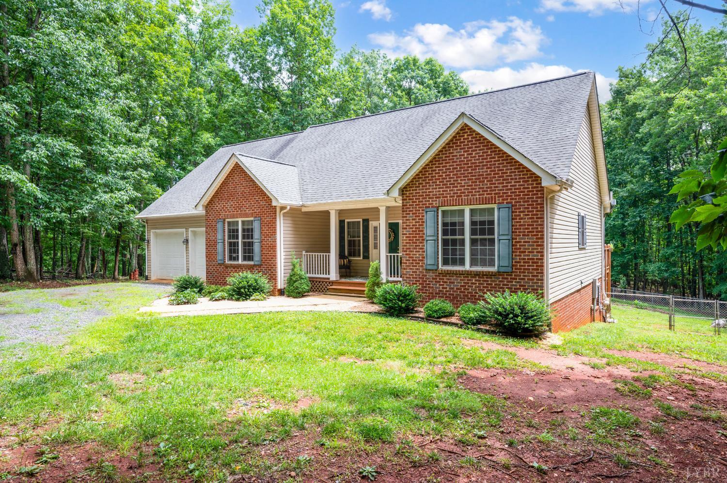 429 Matohe Road Monroe, VA 24574 - Photo 68 of 73 a front view of a house with a yard and garage