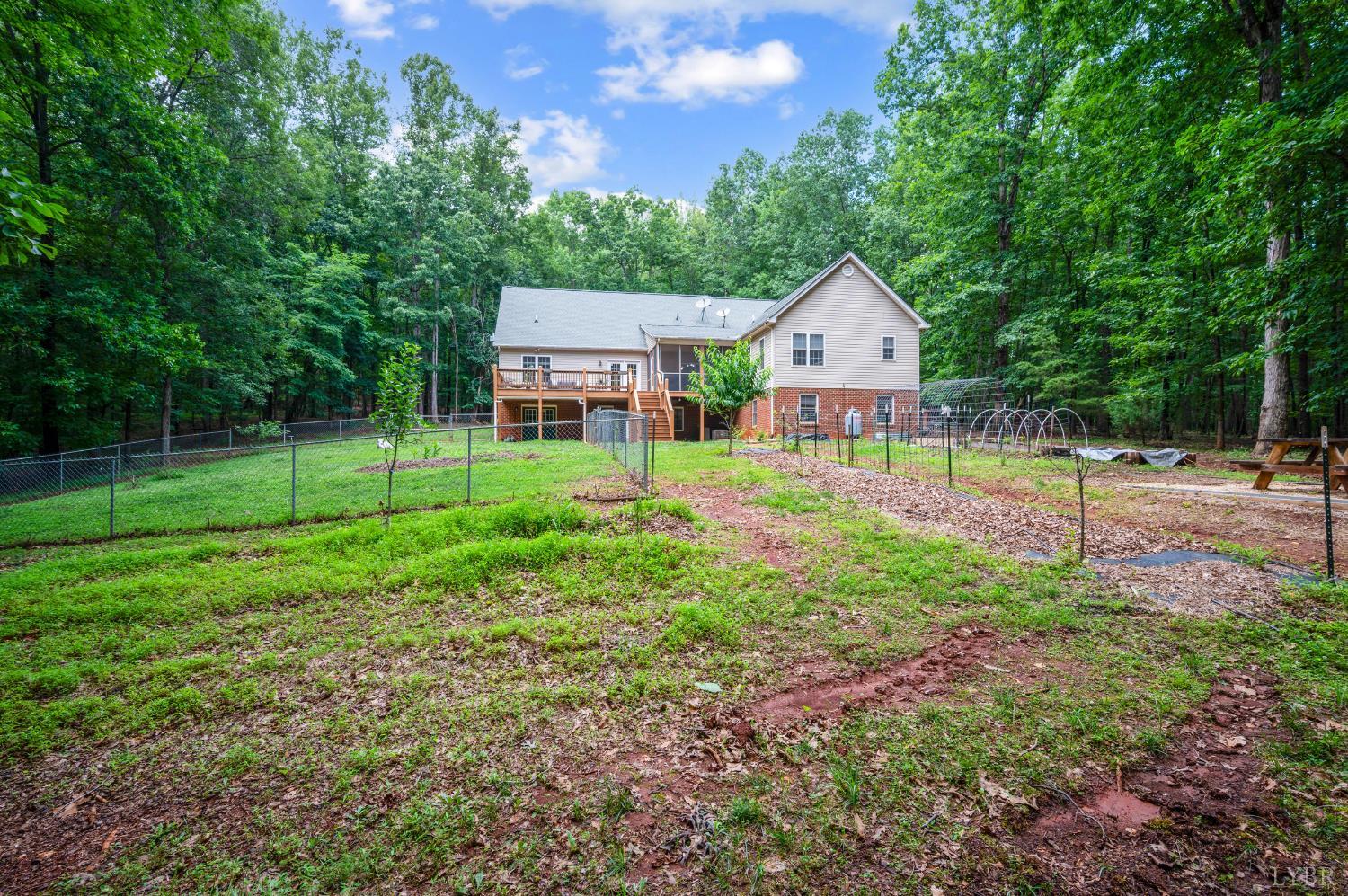 429 Matohe Road Monroe, VA 24574 - Photo 69 of 73 a view of a house with backyard and a tree