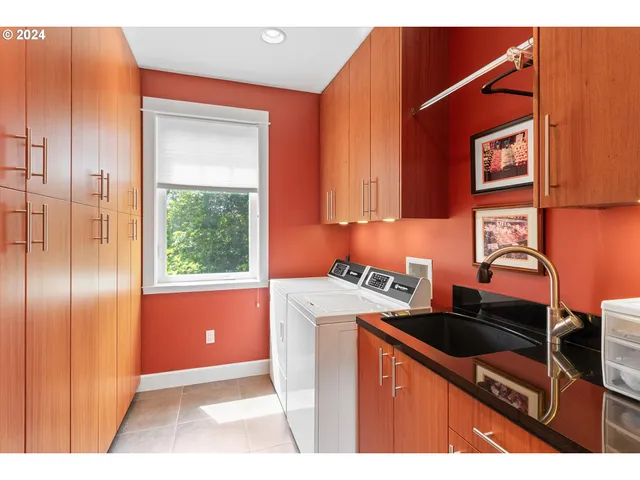 a kitchen that has a sink and a stove in it