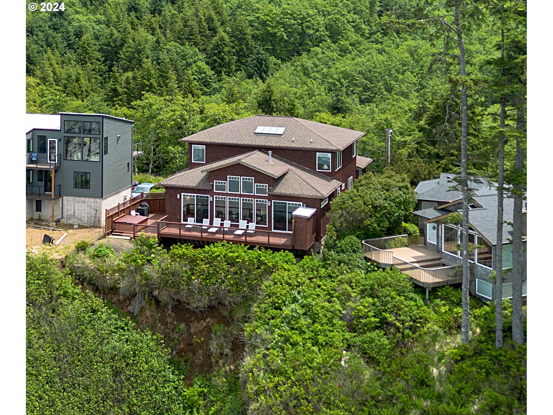 50040 South Beach Road Neskowin, OR 97149 - Photo 2 of 46 an aerial view of a house with swimming pool and garden
