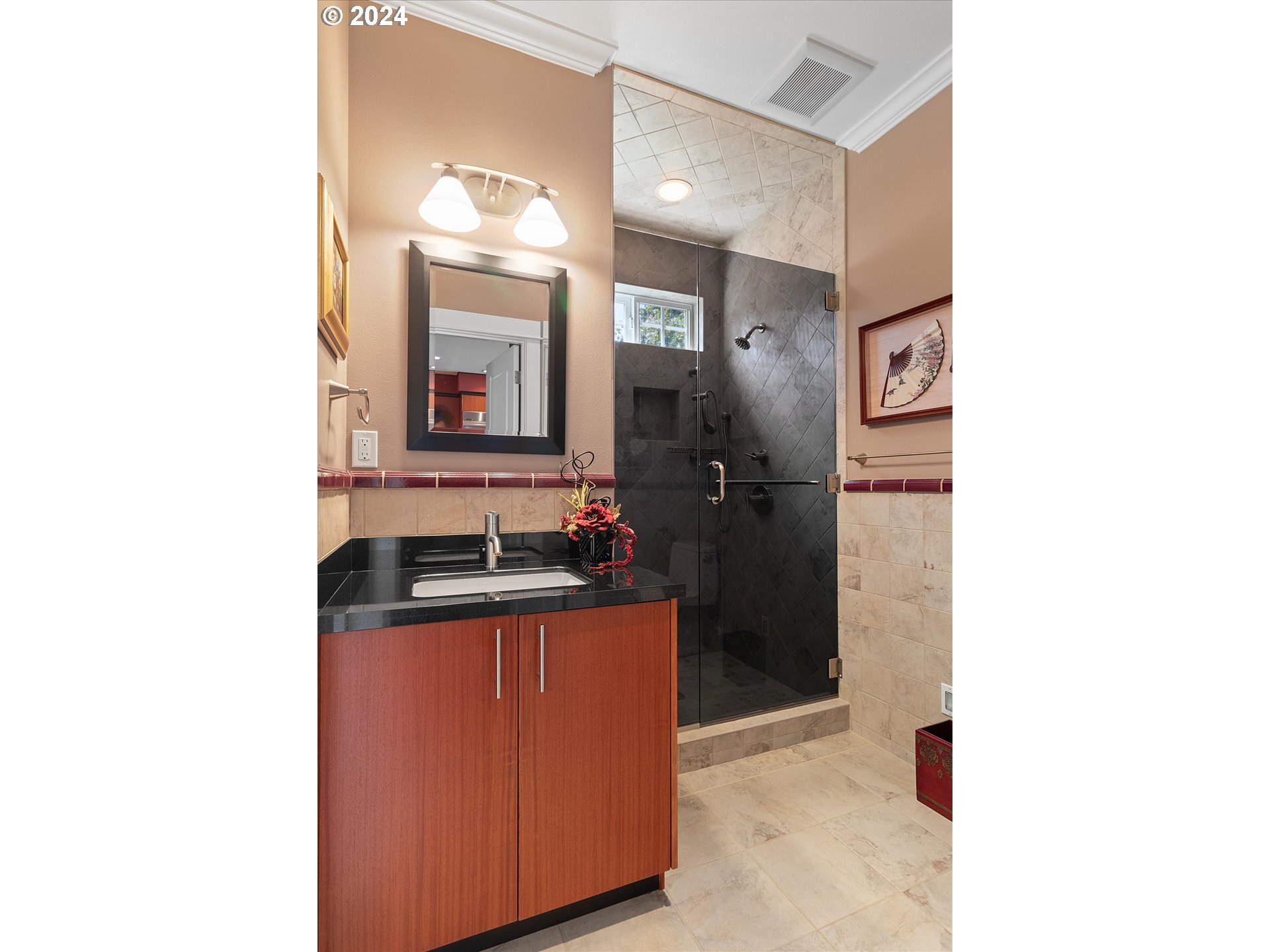 50040 South Beach Road Neskowin, OR 97149 - Photo 21 of 46 a bathroom with a sink a mirror and a shower