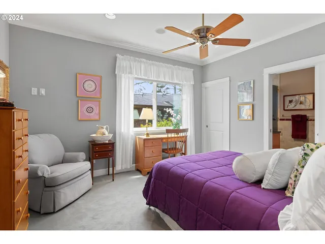 a bedroom with a bed and dresser